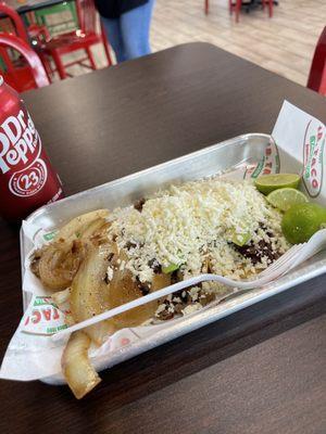 Meal barbacoa taco & bistek taco with grilled onions