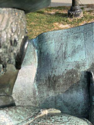 The Newspaper Reader Sculpture