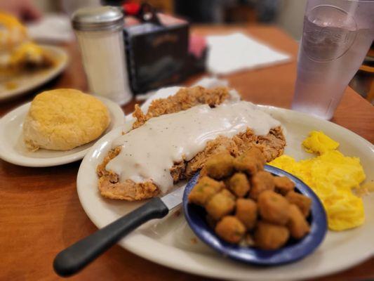 The large chicken fried steak and egg meal with fried okra.