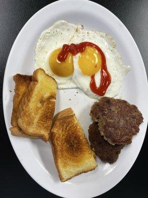 Eggs sunny side up, toast, sausage patties. Very good!