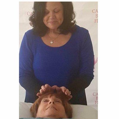 Rita doing Healing Touch on a client.