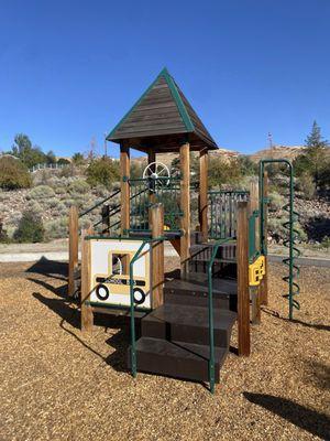 The smaller of the two play structures.