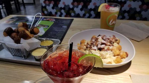 Pretzel bites and cheese and bacon tots.