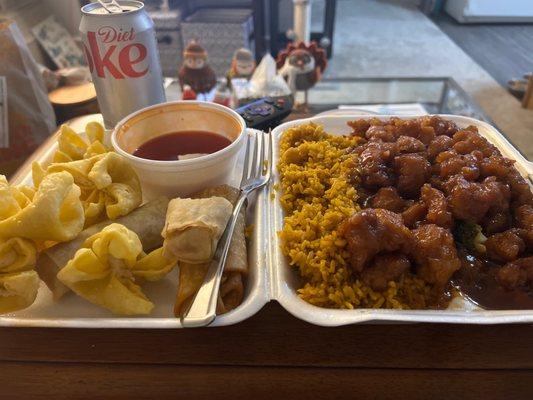 General Tso's chicken, spring rolls, an egg roll, fried rice, and sweet and sour sauce (Diet coke is my own)