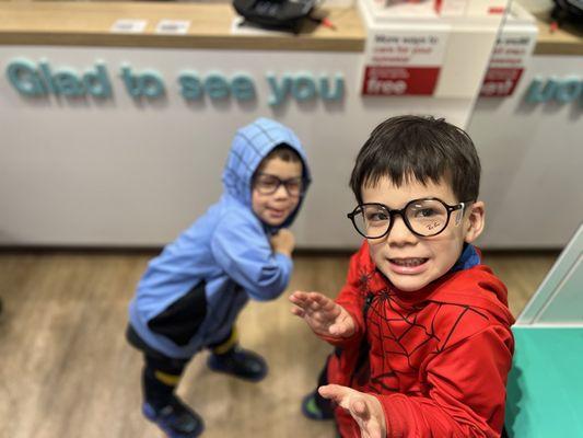 Even though they don't need glasses, they had fun trying some out!