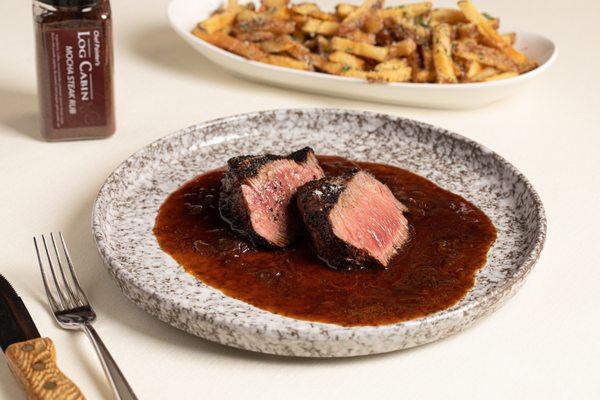 Mocha rubbed 8oz. 21 Day Dry-Aged Barrel Cut Ribeye Steak with truffle fries with Parmigiano Reggiano cheese and black truffle sea salt.