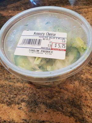 Cabbage salad with Manouri cheese label.