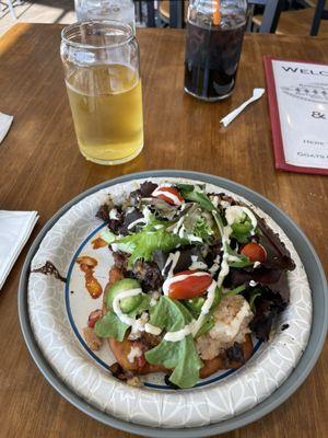 This is their famous open face burger. The bun is an Indian taco. Fixings on this burger are so tasty and original. Worth the visit.