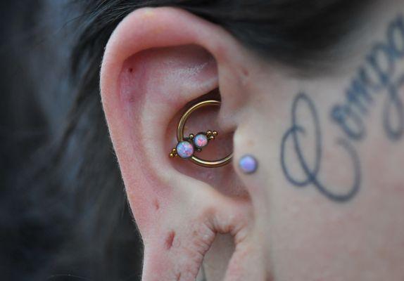 Daith Piercing wearing a Niobium C.B.R. with synthetic Lavender Opals.