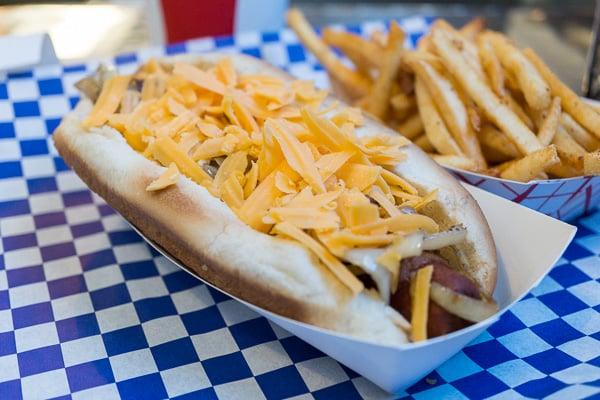 Cobra and fries: Bacon-wrapped dog with BBQ sauce, cheese, grilled onions. Delicious