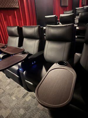 Reclining seats with tray table
