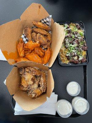 Garlic Parmesan, Cajun lemon pepper and buffalo wings with a side of Tri tip garlic noodles
