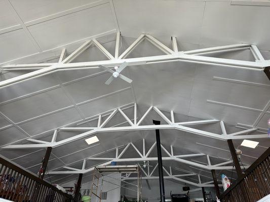 20 ft high prime and paint raw wood and paneling