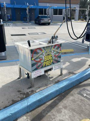 Pre-wash prep area. Brushes to clean front, wheels and windshield