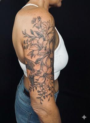 Floral Hummingbird half sleeve by James