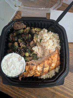 Grilled salmon, rice, brussel sprouts, and dill sauce