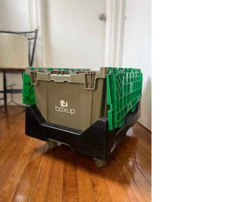 A BoxUp moving bin on a bin dolly.