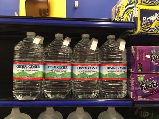 Geyser natural alpine water, tastes good and the handles allows you to comfortably carry 4 gallons in two hands.