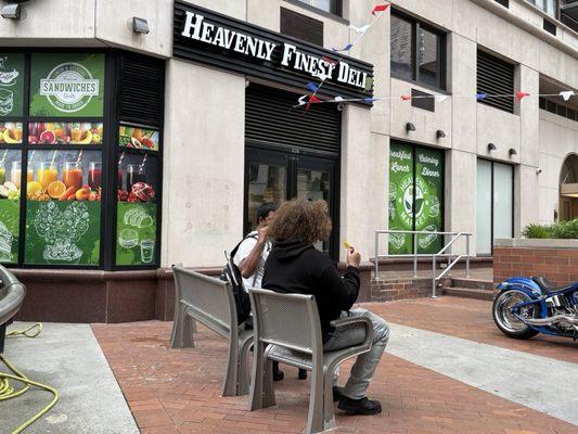 Public space outside of the deli. Public Space is a building requirement in NYC. 05/17/25