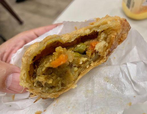 Inside of the Aloo puff. Flaky, spicy and tasty, but also slightly greasy.