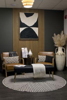 Our chic lobby welcomes you with plush seating, warm lighting, and serene vibes--perfect for your natural beauty journey!