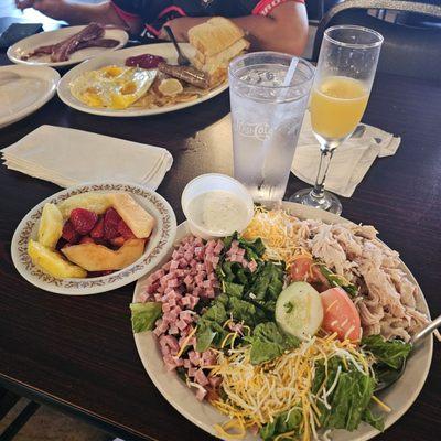 Chef's salad (sorry I got hungry) with fruit instead of bread, lulu's breakfast special, an extra side of bacon and a mimosa.