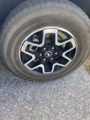 A filthy tire AFTER GOO GOO CAR WASH.