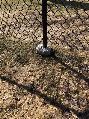 They fixed the ice heaved fence posts and eliminated the gaps between the fence and ground