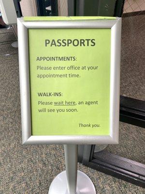The sign outside of the passport office