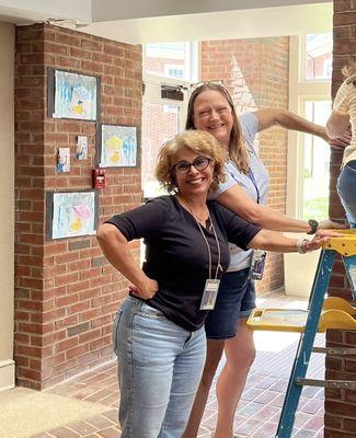 Teachers setting up for our annual student art show.