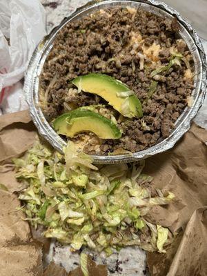 It's a poor excuse for some steak and it's basically just rice with two slices of avocado and brown lettuce