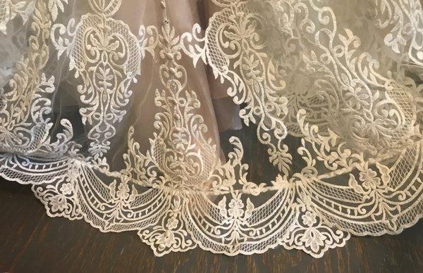 This is your attempt at hemmingher dress. Which left a very visible line all the way across the whole bottom of the dress. .