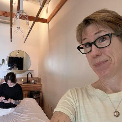 Trying to capture the ceiling bars used for the ashiatsu massage while Alicia processes the gift card I purchased.