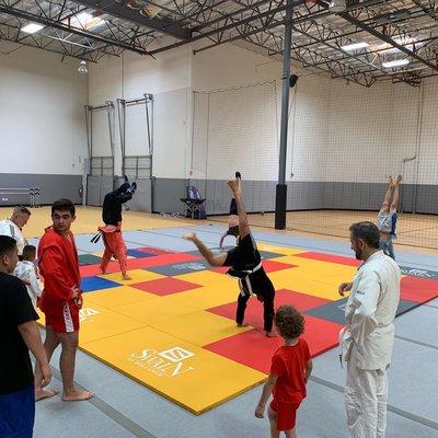 Sambo class: Followed by acrobatics: rolls, hand stands and flips.