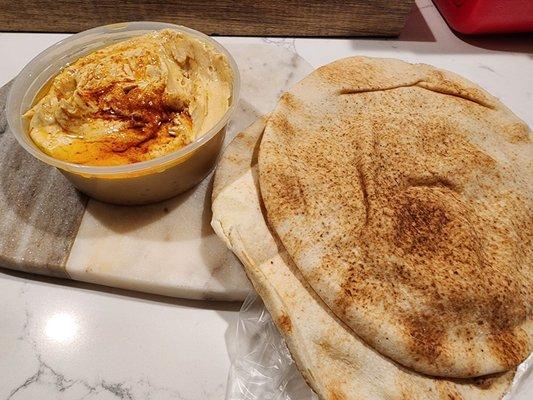 Homemade hummus and side of warm pita bread.