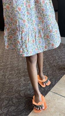 Bella made a design inspired by the flowers on her dress. The nail art is on her big toes. Very cool!!
