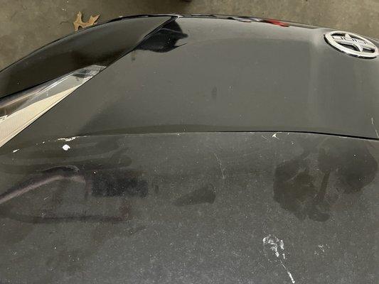 The front of the hood shows the bondo and paint cracking.