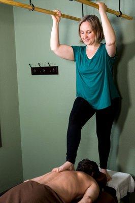 Maya Nicholls, CMT and owner of Maya's Massage performing her specialty Ashiatsu.