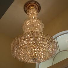 Located in Tampa, FL Chandelier removed from 28' ceiling relocated to 14' ceiling by Joe & Judy typical electrical installation.