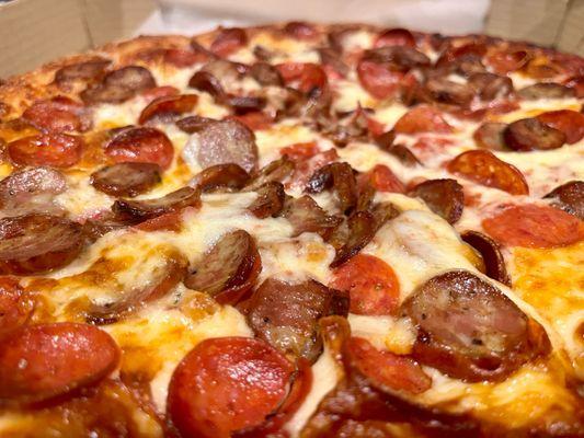Large pepperoni and sausage pizza