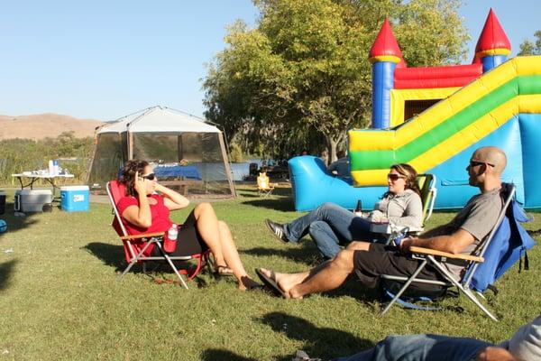 To give you an idea of the size of the bounce house compared to the adults sitting nearby.