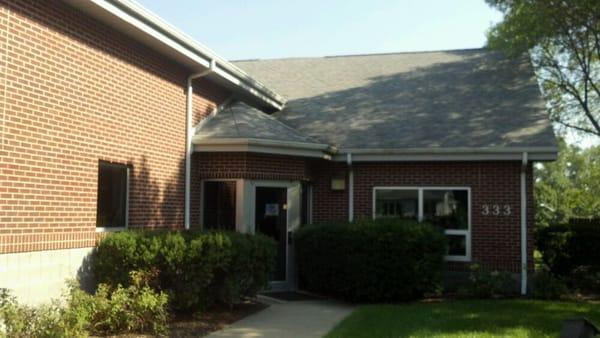 Front door (ring bell just inside the 1st set of doors)