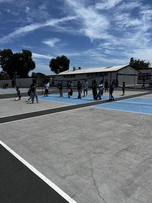 Clean, resurfaced and painted blacktop (volleyball and basketball courts)