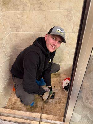 Lucas vs. The Stubborn Shower Drain - and guess who's winning? At Beeline Plumbing, we tackle tough clogs with skill and a smile!