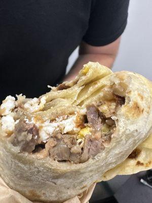 Steak and egg burrito (half eaten, sorry)