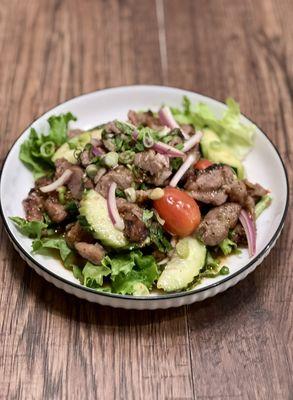 Moo Yang Salad
Our special Thai BBQ pork tender, mints, red onion, scallion, cucumber, and cherry tomato with chili lime dressing.