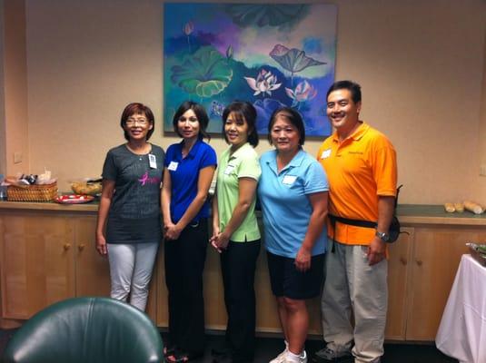 Here is the volunteer massage crew at Queen's Hospital to treat cancer survivors at their seminar.