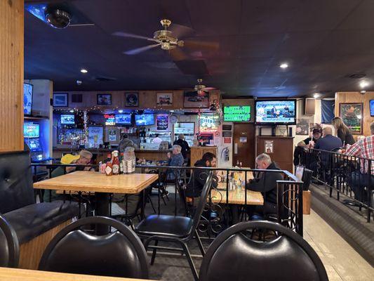 indoor view of the bar, main seating area and raised seating area
