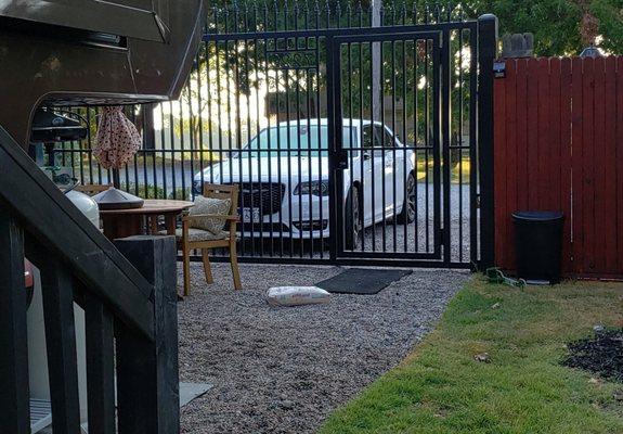 This is looking out our locked gate & door. We have room to park my car, my husband's dually & could even fit a visitor's car in.