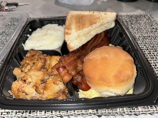 Potato's bacon biscuit eggs bacon sausage link and grits